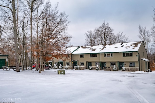 view of snow covered house