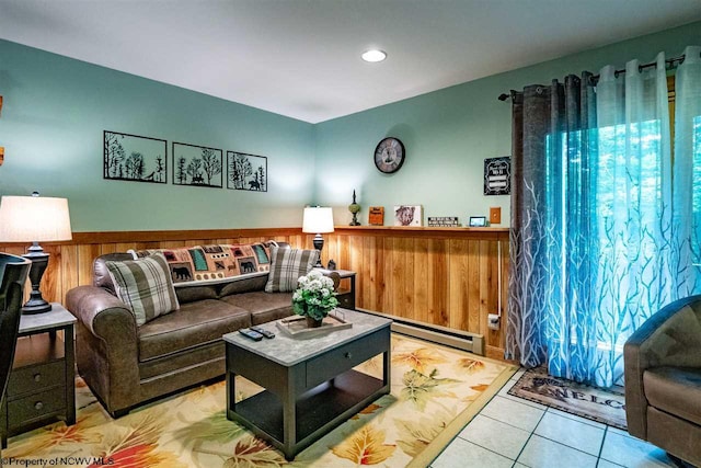 living room with light tile patterned floors and a baseboard heating unit