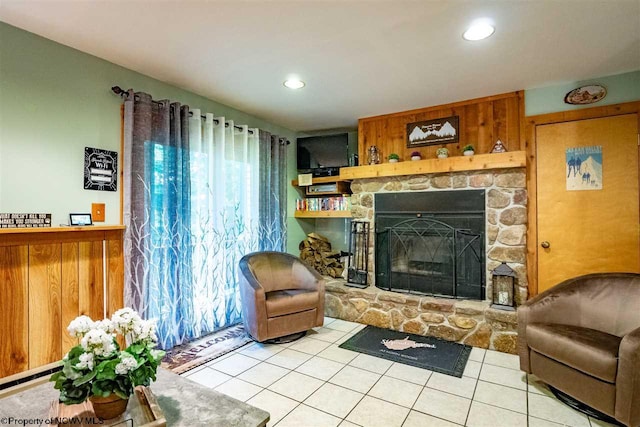 tiled living room featuring a fireplace