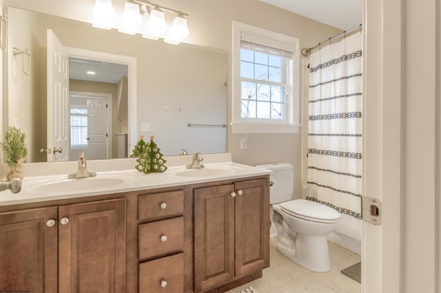 bathroom featuring tile patterned flooring, vanity, a shower with shower curtain, and toilet