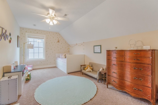 interior space with ceiling fan, light colored carpet, and lofted ceiling