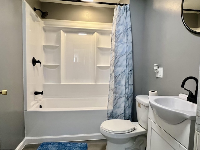 full bathroom featuring vanity, shower / tub combo, and toilet