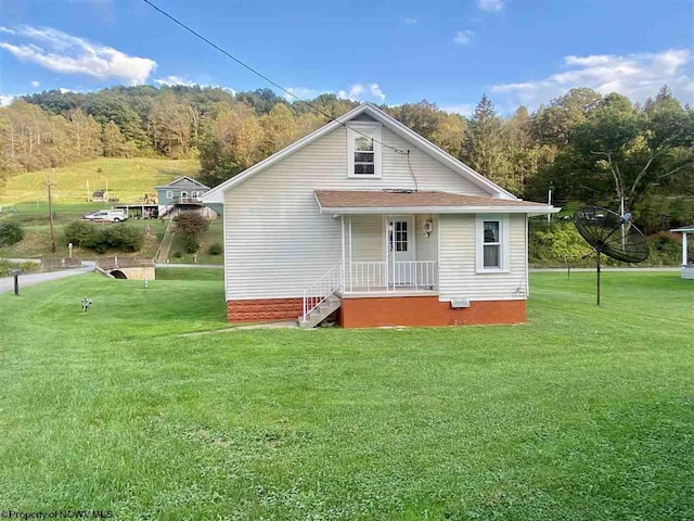 rear view of house with a lawn