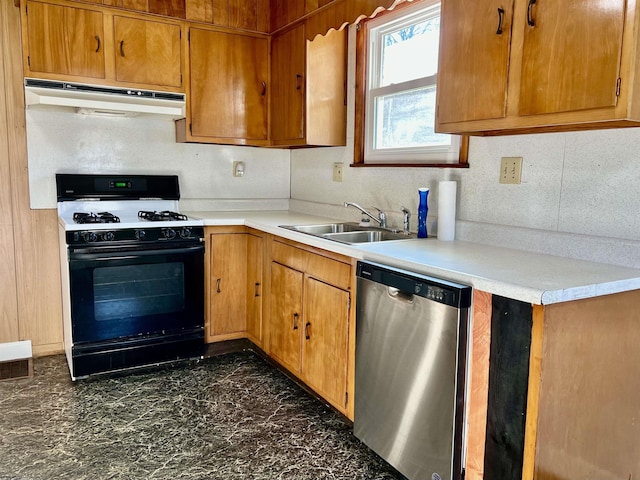 kitchen featuring black range with gas stovetop, stainless steel dishwasher, and sink