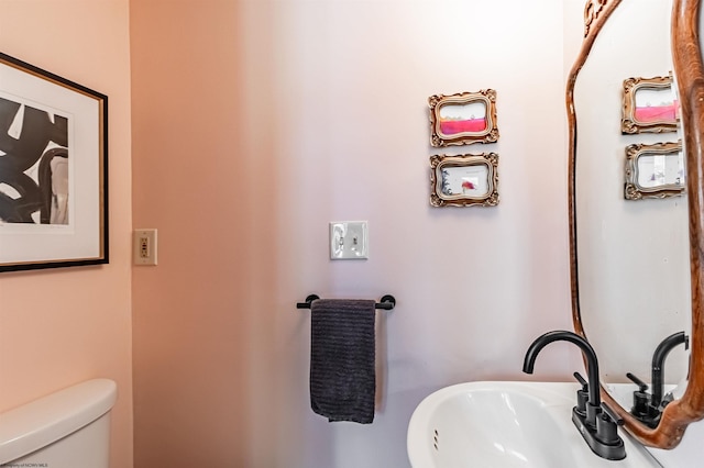 bathroom with sink and toilet