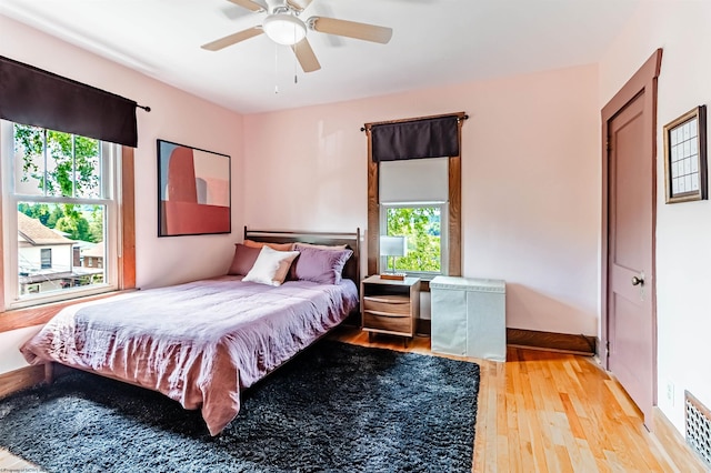 bedroom featuring ceiling fan and light hardwood / wood-style flooring