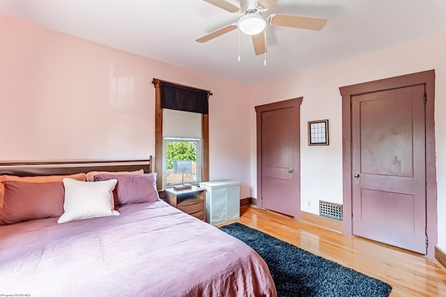 bedroom with ceiling fan and light hardwood / wood-style flooring