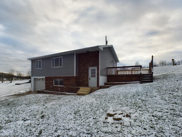 exterior space with a wooden deck and a garage