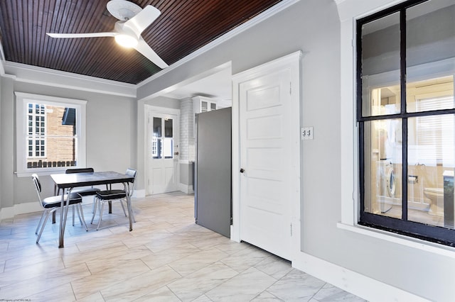 dining area with ceiling fan, crown molding, and wood ceiling