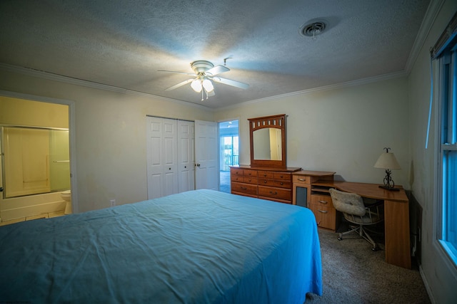 carpeted bedroom with ensuite bath, ornamental molding, a textured ceiling, ceiling fan, and a closet