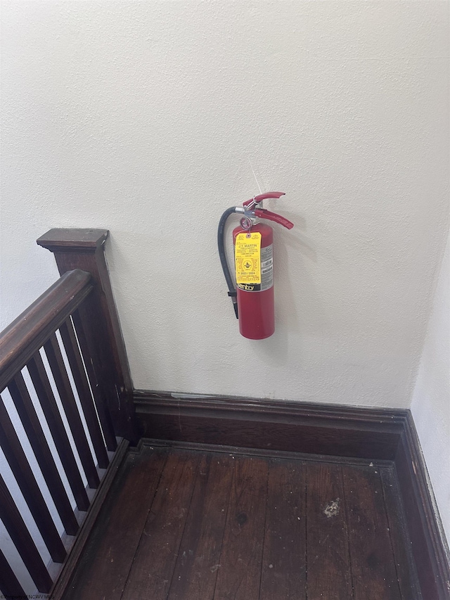 details featuring wood finished floors and a fire extinguisher