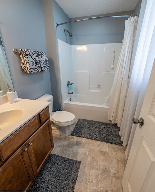 full bathroom with vanity, toilet, and shower / tub combo