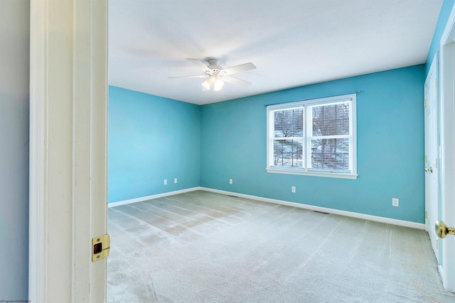 empty room with light carpet and ceiling fan