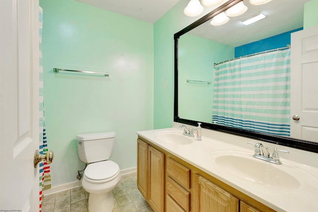 bathroom featuring a shower with shower curtain, vanity, toilet, and tile patterned floors