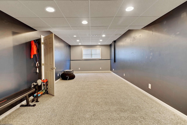 exercise room featuring a drop ceiling and carpet floors