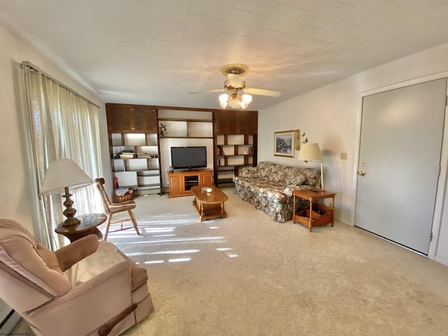 living room featuring ceiling fan and light colored carpet