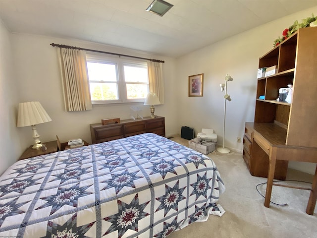 bedroom featuring light colored carpet