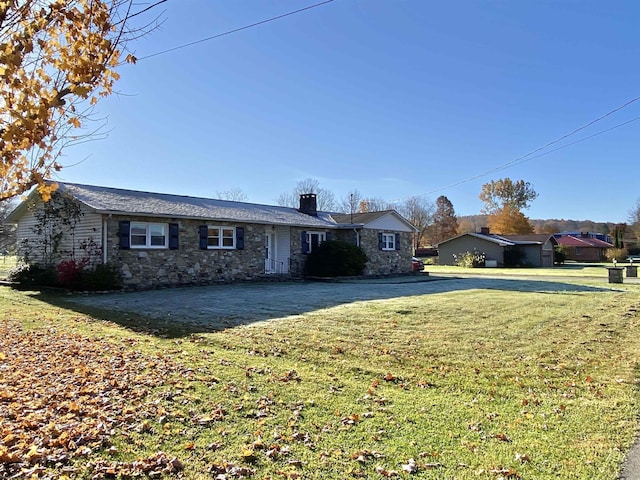 ranch-style house with a front lawn