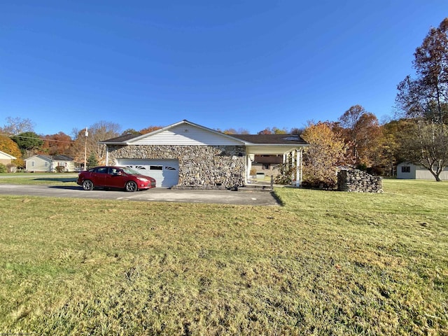 ranch-style house with a front yard and a garage