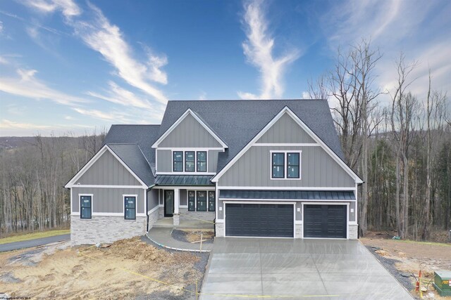 craftsman-style house with a garage, roof with shingles, a standing seam roof, and stone siding