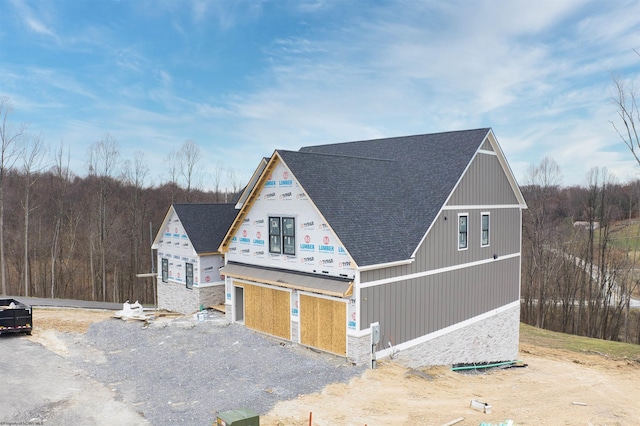 view of front of property with a shingled roof