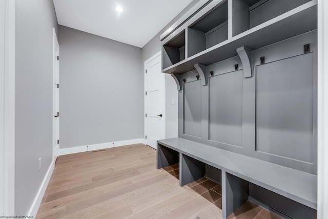 mudroom with light wood-type flooring and baseboards