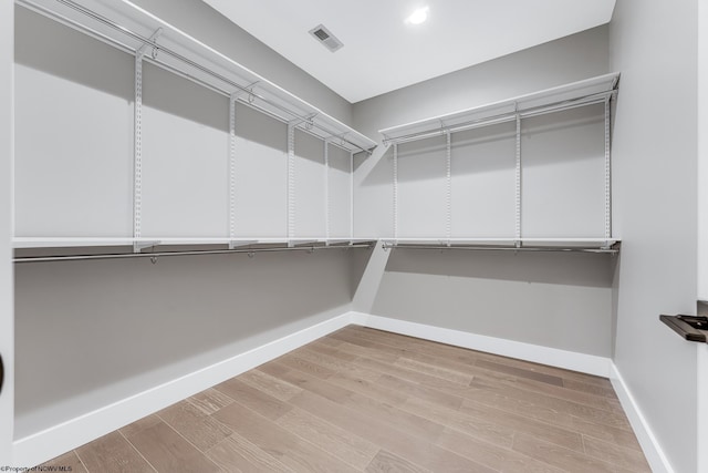 spacious closet featuring light wood-style floors and visible vents