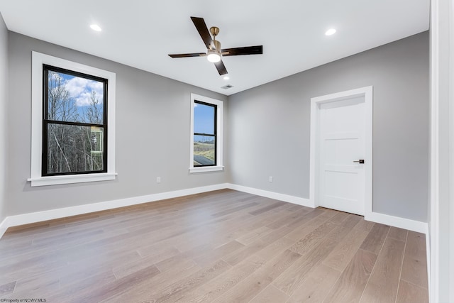 unfurnished room with light wood finished floors, baseboards, a ceiling fan, and recessed lighting