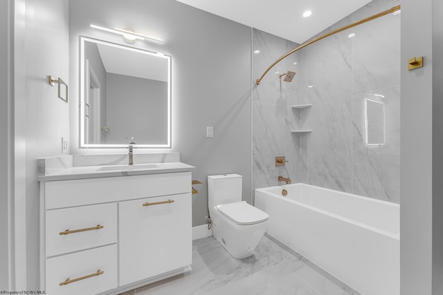 bathroom featuring toilet, marble finish floor, washtub / shower combination, and vanity