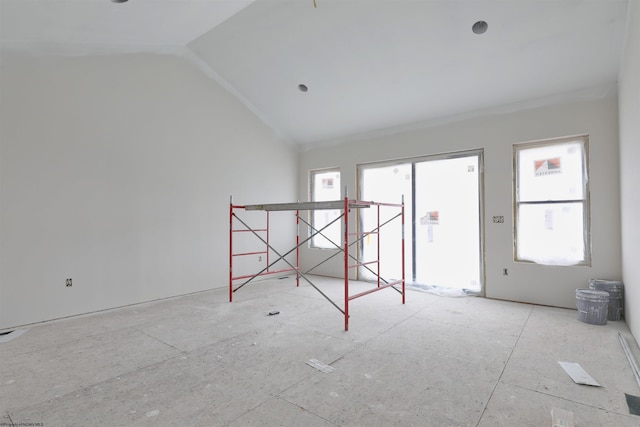 empty room with lofted ceiling