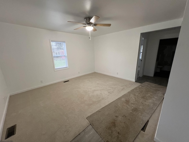 empty room with carpet flooring and ceiling fan