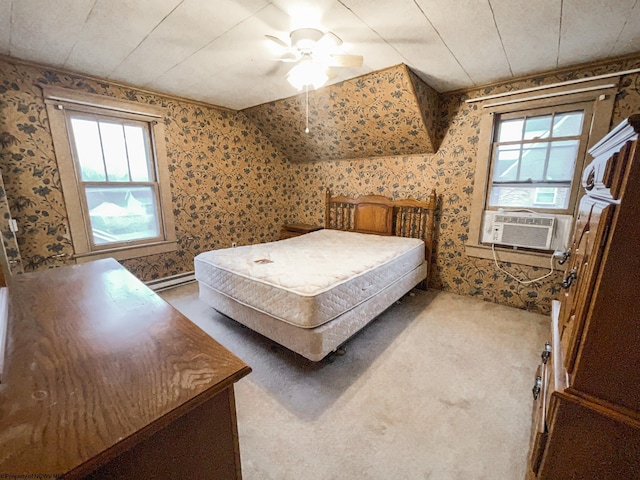 bedroom featuring ceiling fan, carpet floors, and multiple windows