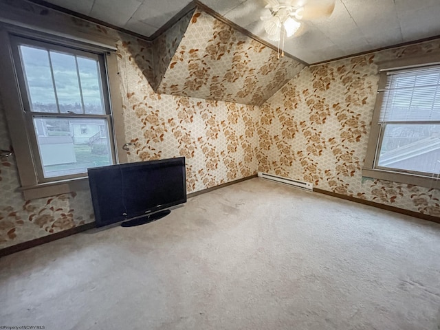 additional living space featuring ceiling fan and carpet floors