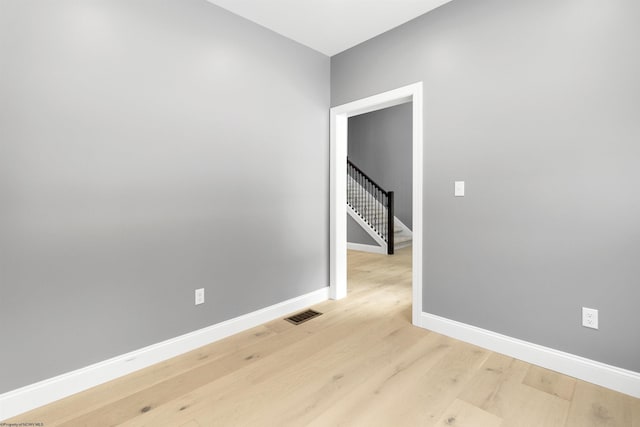 spare room with light wood-type flooring