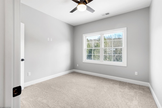 carpeted empty room with ceiling fan