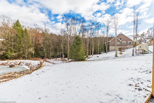 view of yard covered in snow