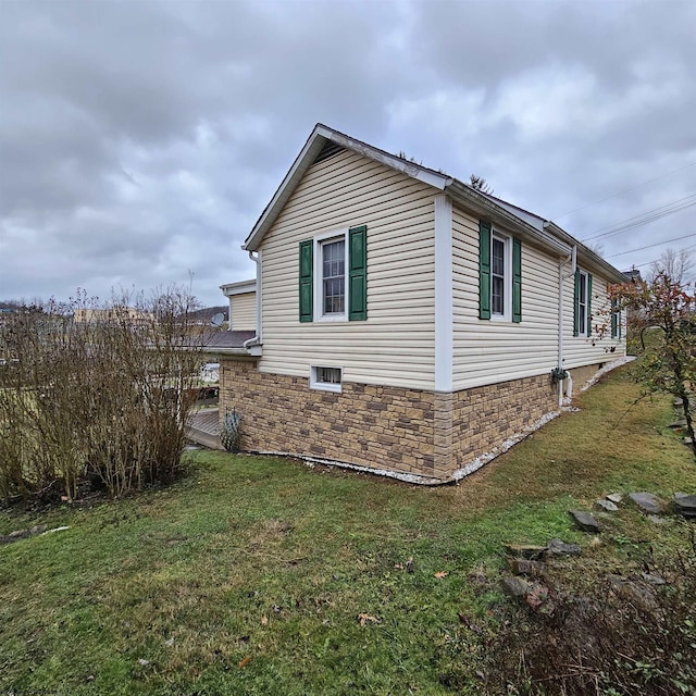 view of home's exterior featuring a yard