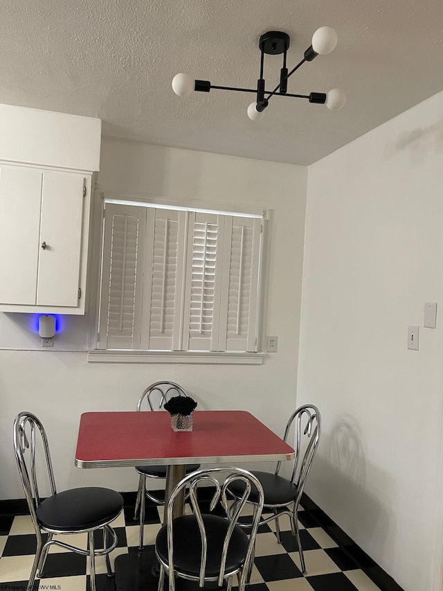 dining room with a textured ceiling