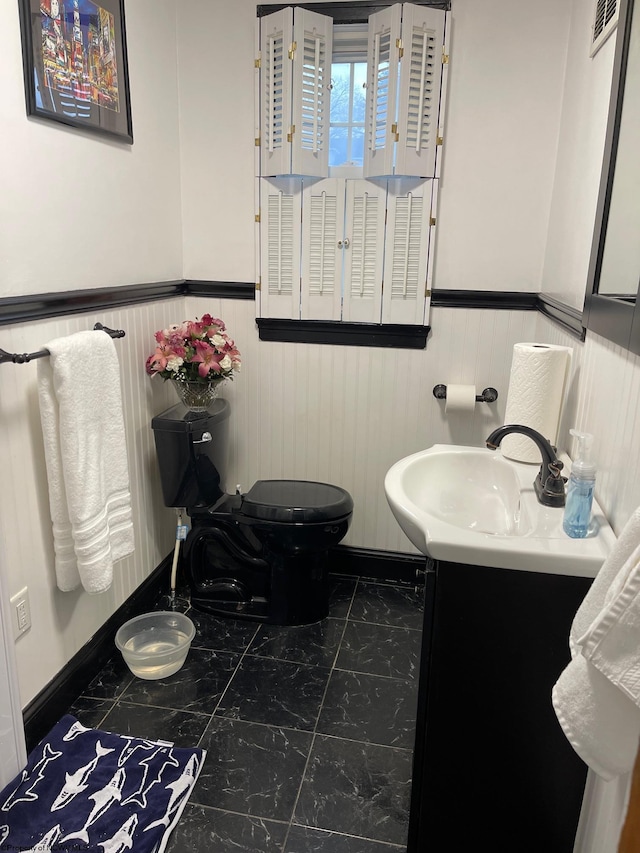 bathroom with vanity and toilet