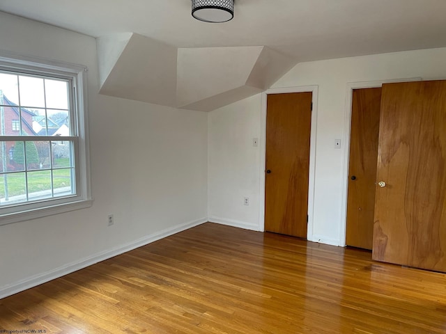 additional living space with light wood-type flooring