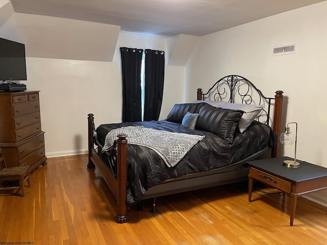 bedroom with wood-type flooring