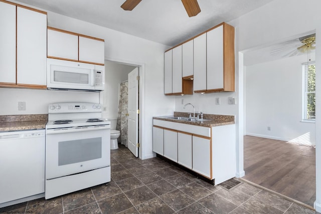 kitchen with white cabinetry, sink, ceiling fan, dark hardwood / wood-style floors, and white appliances