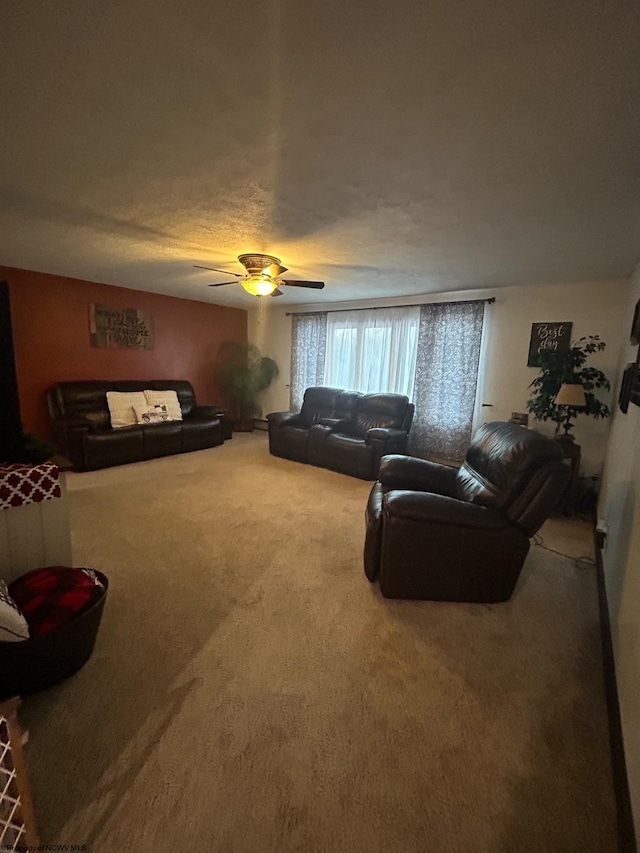 living room featuring carpet and ceiling fan