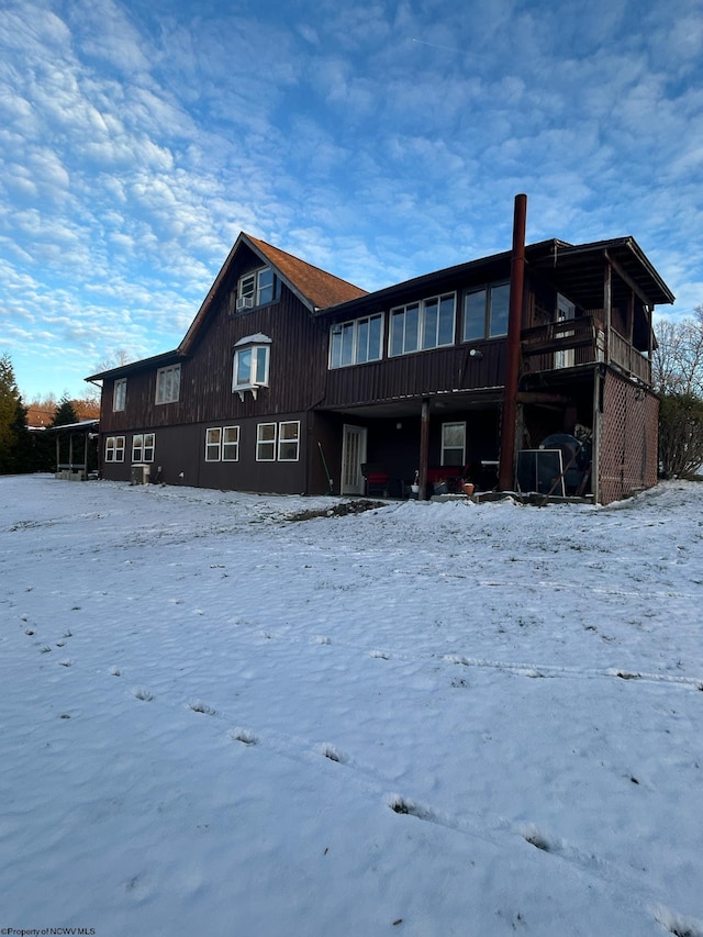 view of snow covered house