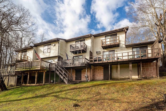 back of house with a lawn and a wooden deck