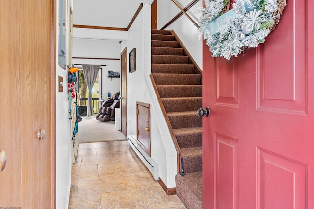 entryway with ornamental molding, light carpet, and a baseboard radiator