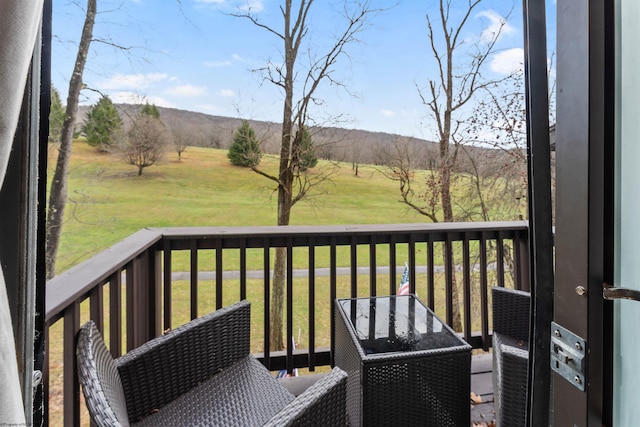 wooden terrace with a yard