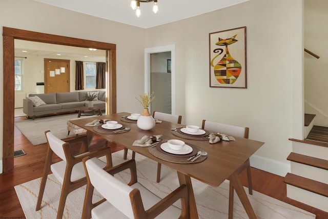 dining area featuring a chandelier and hardwood / wood-style floors