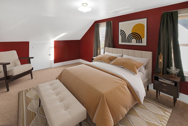 carpeted bedroom featuring multiple windows and lofted ceiling