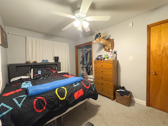 carpeted bedroom featuring a closet and ceiling fan